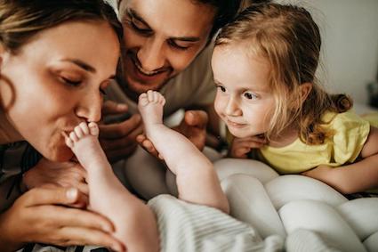 Family-playing-with-new-baby